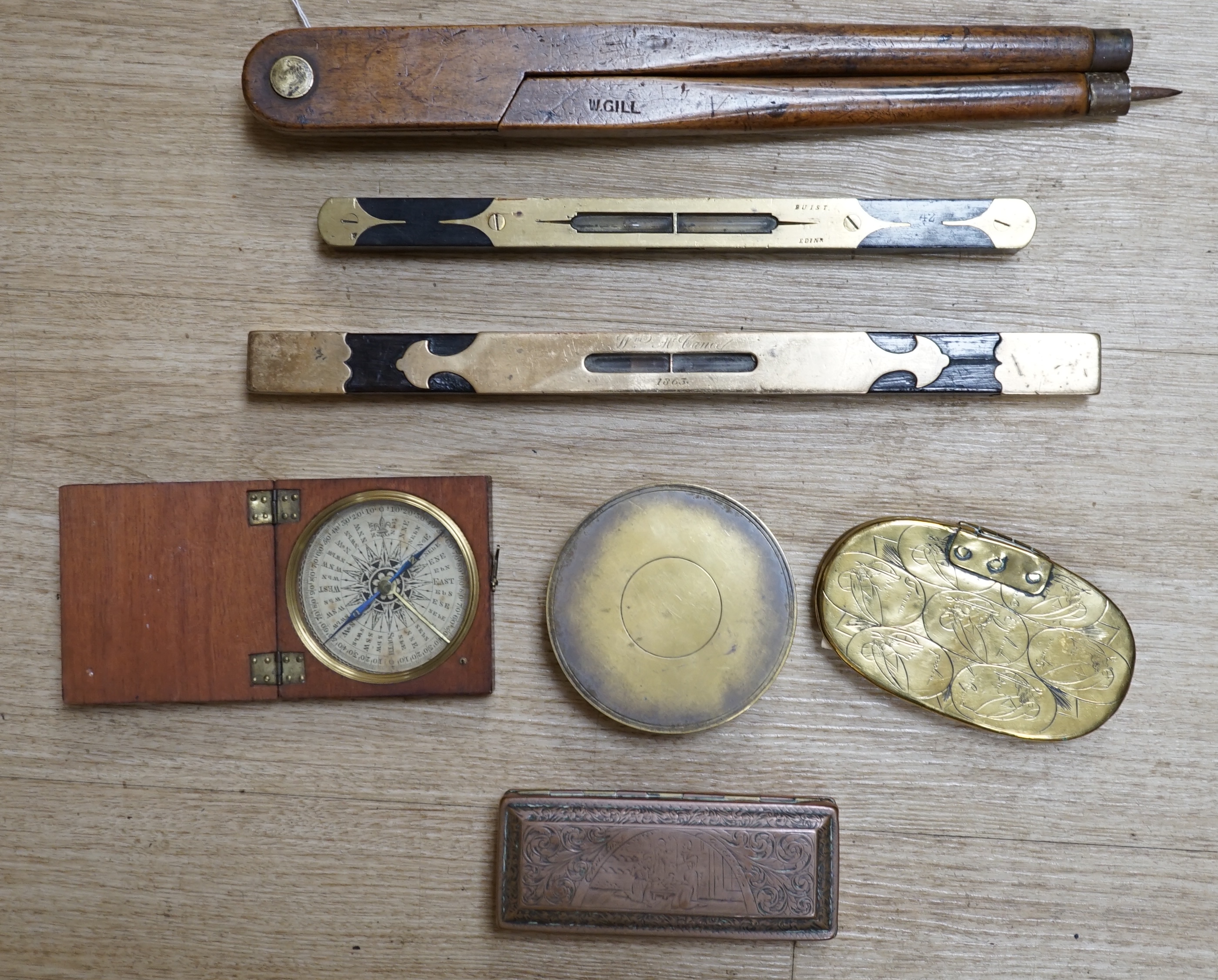 Two portable sundials, two brass inlaid spirit levels and a wood compass, wooden compass 34cm long. Condition - fair to good